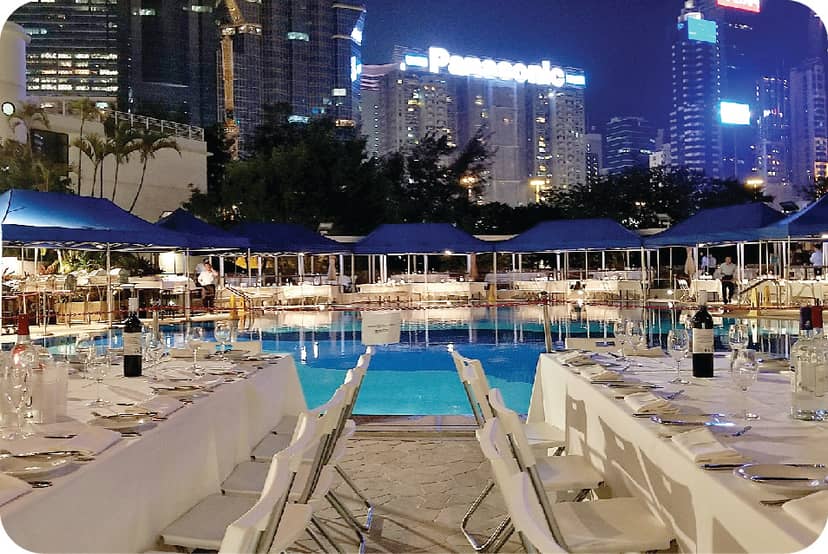 Poolside dining at Royal Hong Kong Yacht Club, ideal for corporate events and gala dinners.
