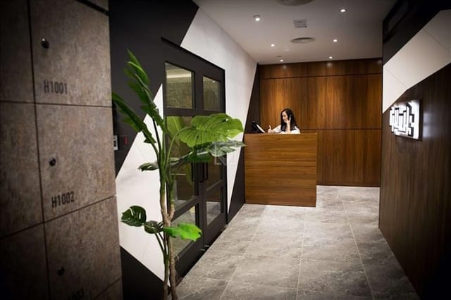 Modern corporate reception area with wood accents, ideal for meetings and events.