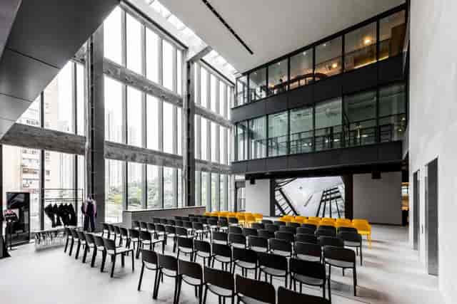 Modern event space with large windows, ideal for corporate meetings and workshops.