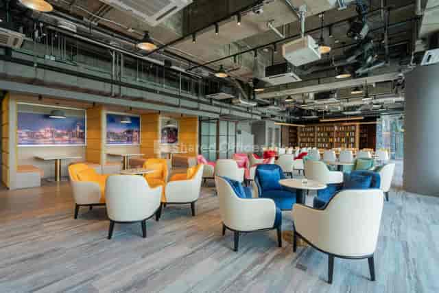 Modern coworking space with colorful seating for creative meetings and networking events.