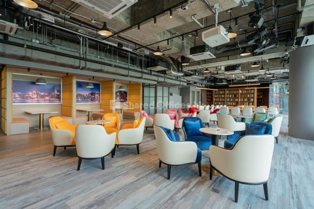 Modern coworking space with colorful seating for creative meetings and networking events.