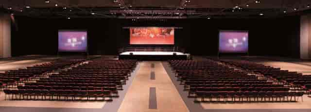 Runway 11 at AsiaWorld-Expo, spacious conference venue with stage and screens.