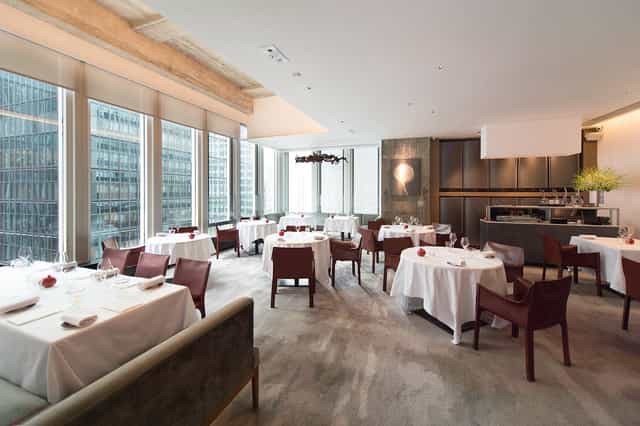 Elegant dining space for corporate events with stunning city views at Maison ES.
