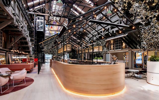 Modern venue with wooden bar, ideal for networking events and social gatherings.