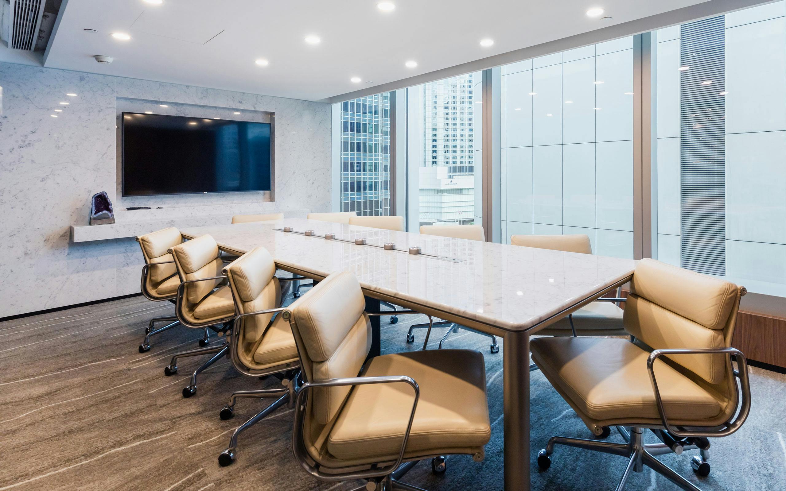 Modern conference room with ergonomic chairs, ideal for meetings and presentations.