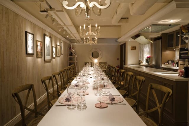 Elegant private dining room with long table, ideal for intimate gatherings and corporate dinners.