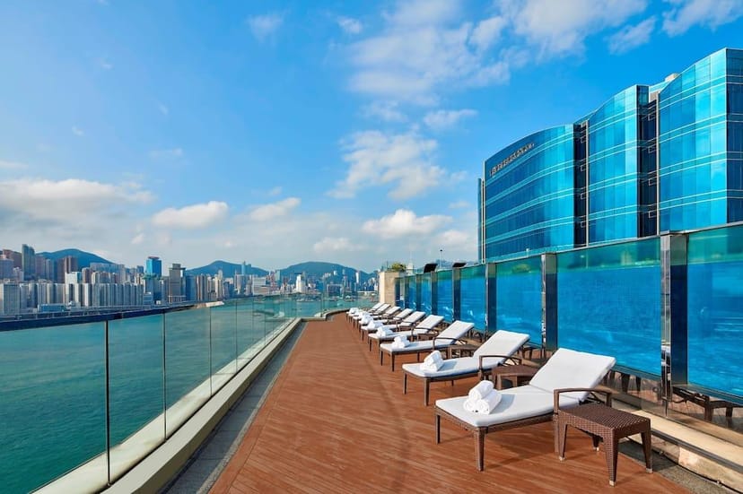 Rooftop patio with lounge chairs, perfect for upscale events and networking receptions.