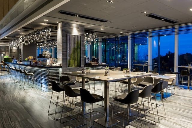Modern conference lodge patio with large windows, ideal for networking events and receptions.