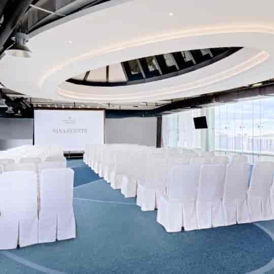 Function Rooms at Nina Hotel Tsuen Wan West with elegant white chairs for corporate events.