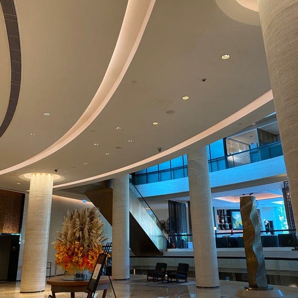 Modern lobby at New World Millennium Hotel, ideal for events and networking.