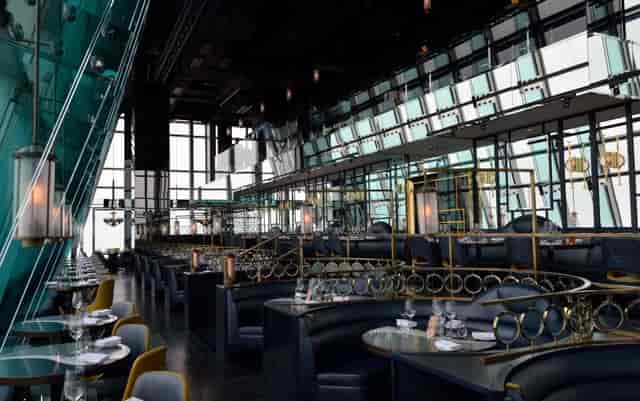 Modern aqua Hong Kong dining room with panoramic views for corporate events and gatherings.