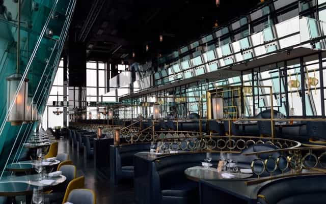 Modern aqua Hong Kong dining room with panoramic views for corporate events and gatherings.
