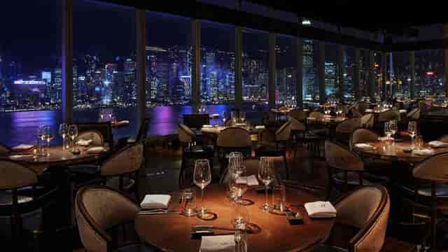 Rooftop bar in Aqua Hong Kong with skyline views, perfect for upscale events and dining.