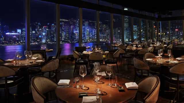 Rooftop bar in Aqua Hong Kong with skyline views, perfect for upscale events and dining.