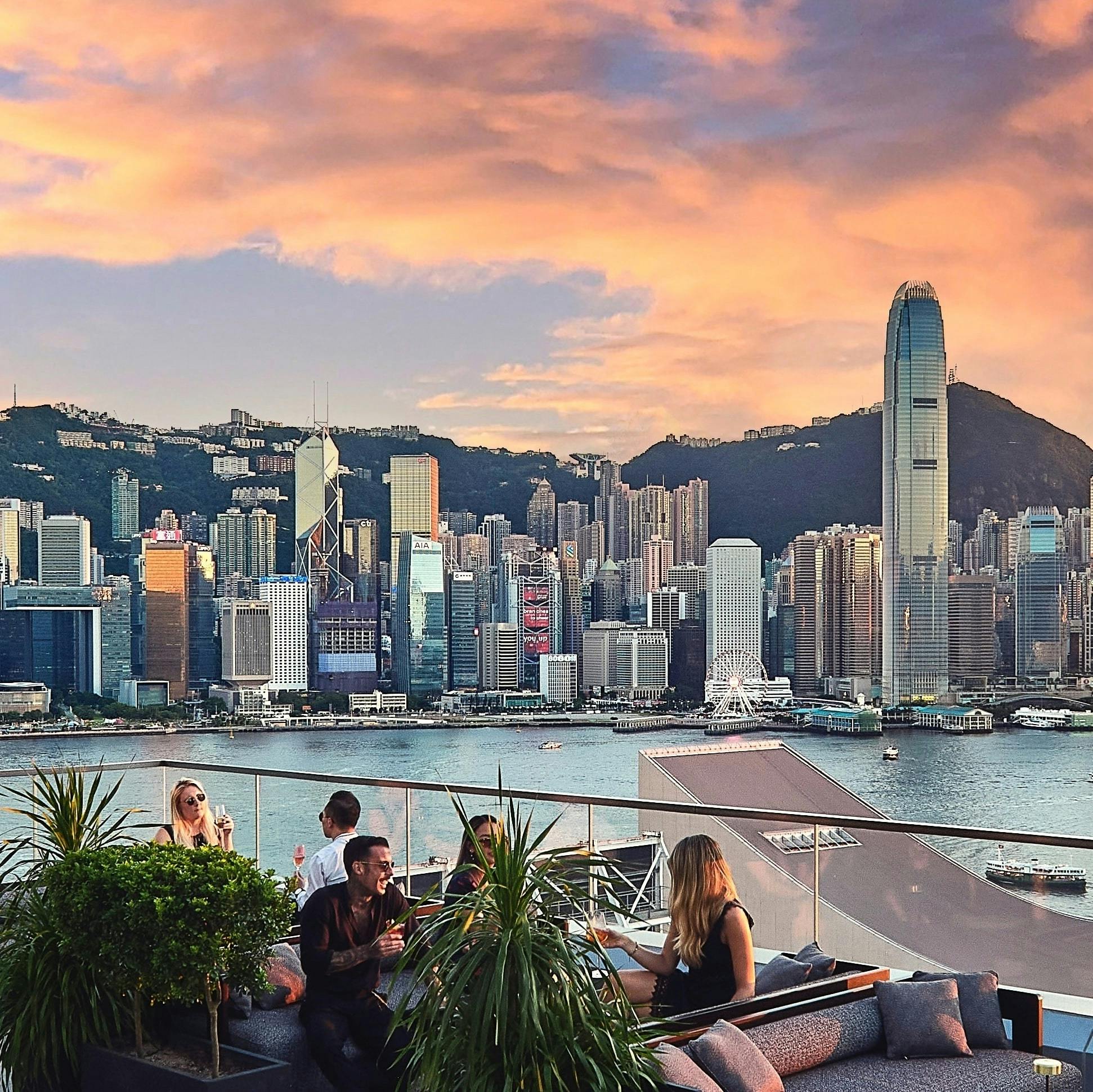 Stylish rooftop bar in Aqua Hong Kong with skyline view, ideal for networking events.