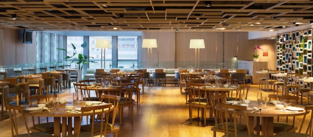 Modern restaurant in Hotel Jen Hong Kong, ideal for events with warm wood tones.