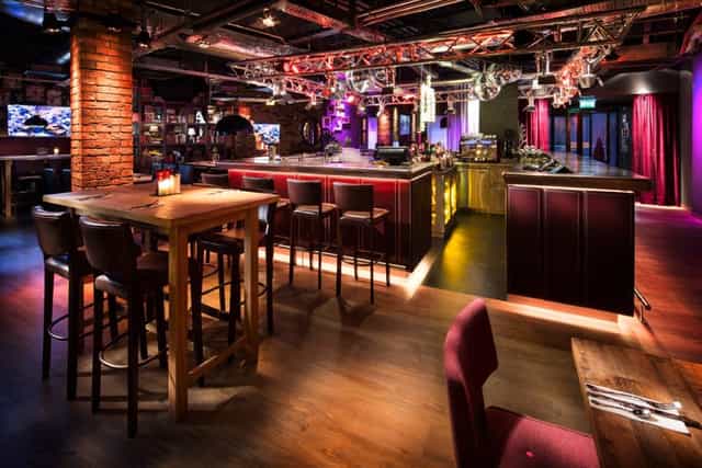 Pentalounge event space with stylish bar, ideal for cocktail receptions and team-building.
