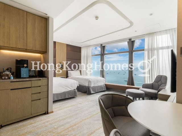 Modern hotel room with large windows, perfect for small meetings and retreats.
