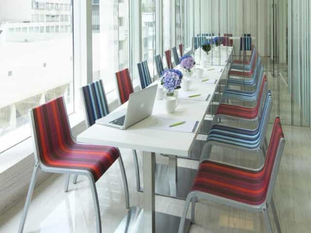 Modern conference room at iclub Fortress Hill Hotel with vibrant chairs, ideal for workshops.