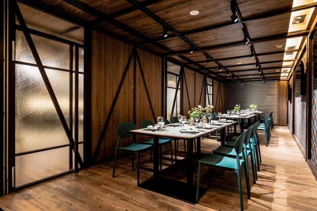 Modern meeting room with warm wood tones for corporate events and private gatherings.