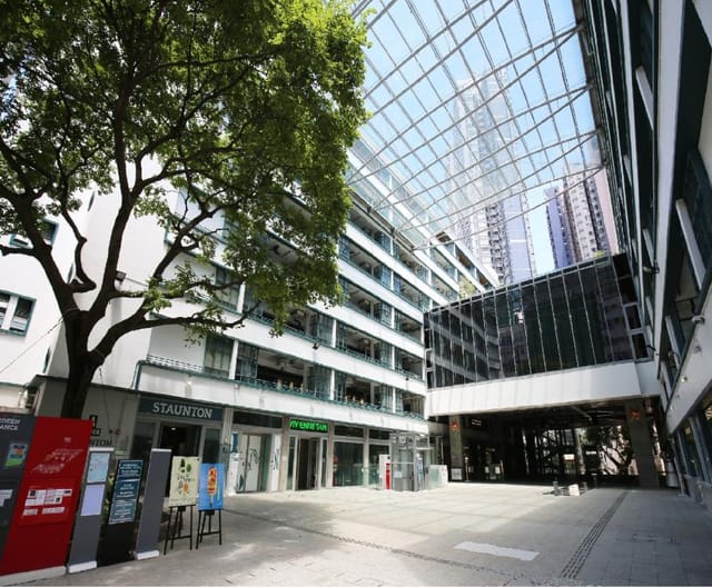 Modern open-air venue at PMQ with glass roof, perfect for networking events.