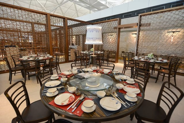 Elegant dining setup at Maxim's Chinese Cuisine for corporate events and banquets.