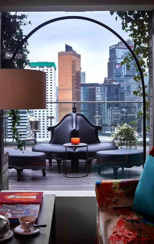 Stylish outdoor lounge at SEVVA with sleek black seating, perfect for networking events.