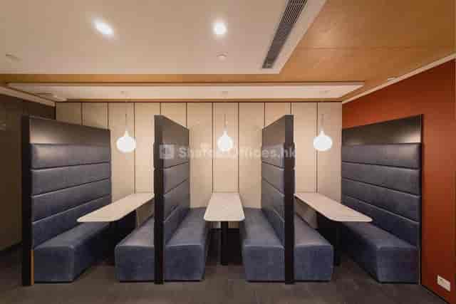 Modern meeting space with cozy booths for collaborative discussions in Hong Kong.