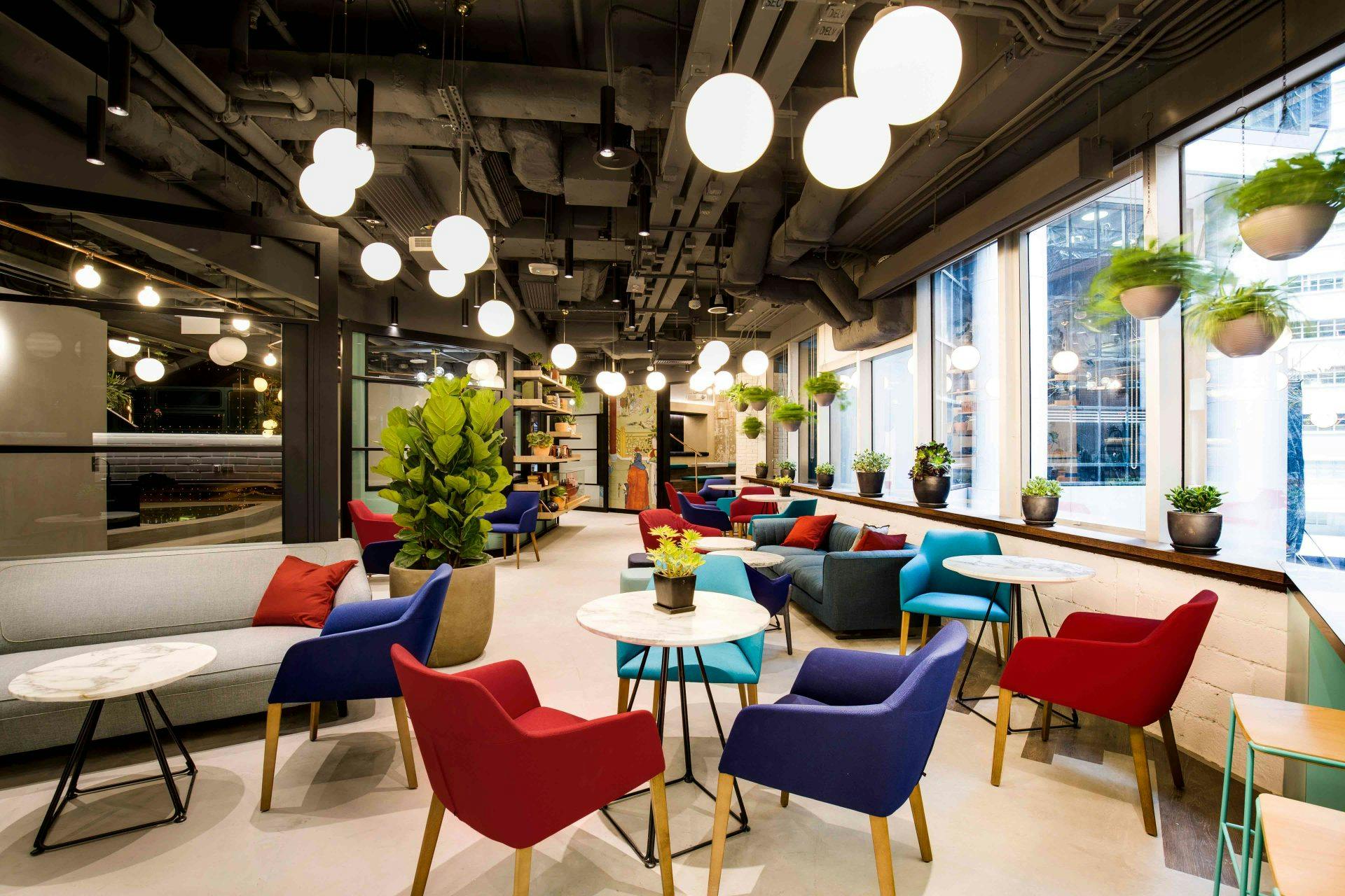 Modern lounge with colorful seating, ideal for networking events and meetings.