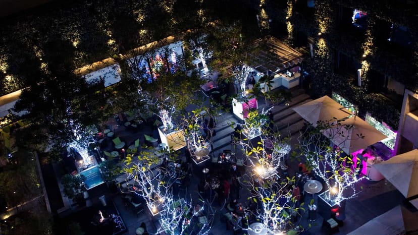 Open-Air Lounge in Vibes with decorative lighting for networking and social events.
