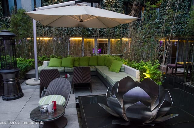 Stylish outdoor lounge with comfortable seating for networking events and casual meetings.