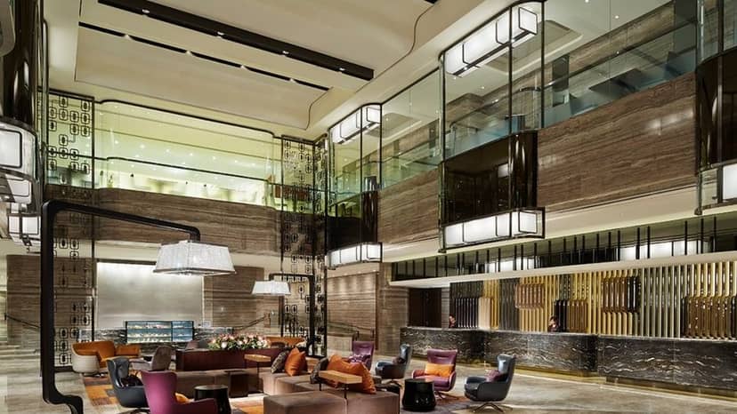 Modern hotel lobby at Royal Plaza, spacious seating for events and gatherings.
