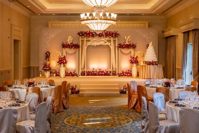 Disney Fairy Tale Weddings stage with floral decor, ideal for elegant weddings in Hong Kong.