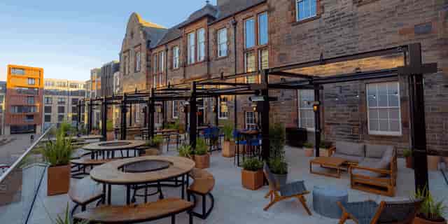 Outdoor event space at BrewDog Edinburgh with communal tables and lounge seating.