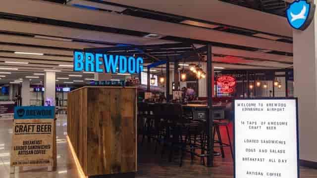 BrewDog Edinburgh airport restaurant with modern decor for casual meetings and networking.