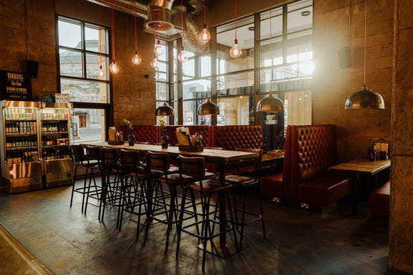 Stylish BrewDog Lothian Road beer garden with booth seating for networking events.