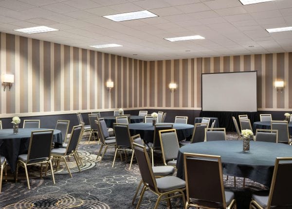 Conference Hall at Regal Hongkong Hotel with round tables, ideal for corporate events.