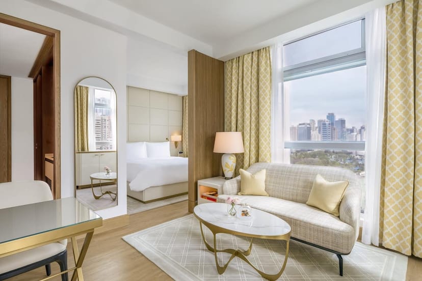 Modern hotel suite at Lanson Place, spacious with stylish furnishings for meetings and retreats.