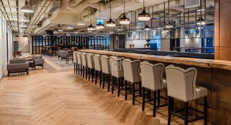 Modern private office with stylish bar, ideal for cocktail receptions and corporate events.