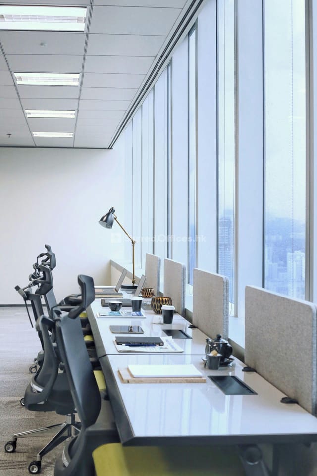 Modern private office with ergonomic chairs, ideal for meetings and events.