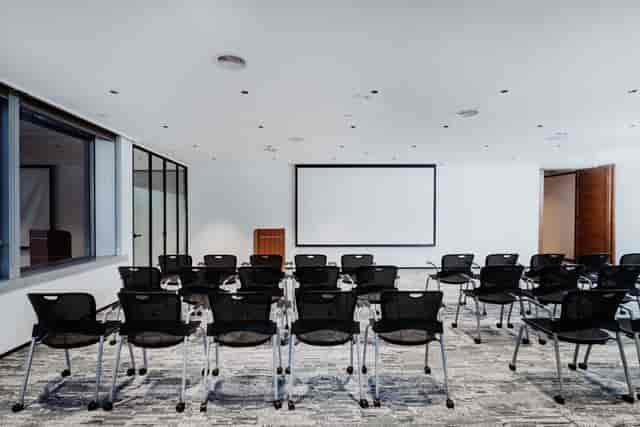 Versatile meeting room with movable chairs for workshops and presentations at Eaton Club.