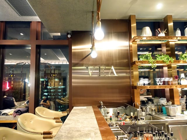 Private dining room at VEA with sleek bar, ideal for networking events and cocktail receptions.