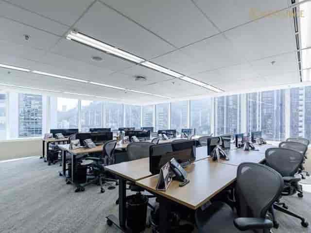 Modern private office with large windows, perfect for workshops and team brainstorming.