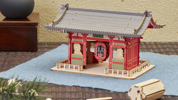 Miniature Japanese gate model in Seven Seas Pacific Aviation Lounge, ideal for cultural events.