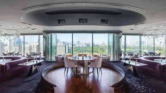 Sky Room at The Peninsula Tokyo: elegant dining space with panoramic city views for corporate events.