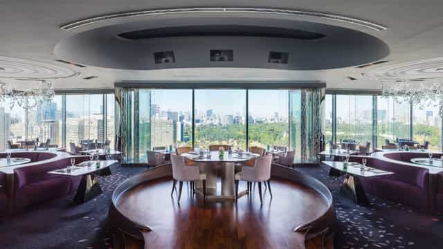 Sky Room at The Peninsula Tokyo: elegant dining space with panoramic city views for corporate events.