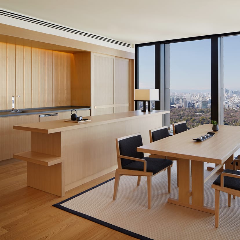 Modern meeting room in Aman Tokyo with large windows and warm wood tones, perfect for events.