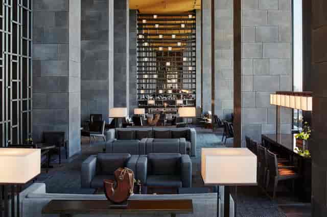 Sophisticated Aman Tokyo meeting room with sleek furniture for networking events.