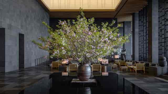 Boardroom in Aman Tokyo with elegant floral arrangement for upscale events and meetings.
