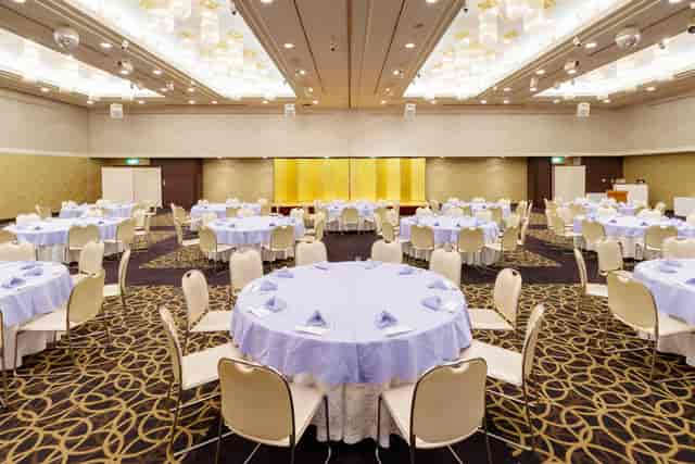 Magnolia Hall at Tokyo Prince Hotel, elegant round tables set for weddings and galas.